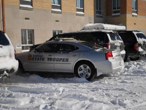 Kansas state trooper vehicle parked in the snow