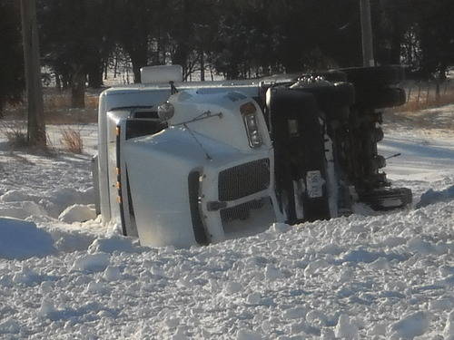 Semi truck turned over west of Melrose on Highway 166