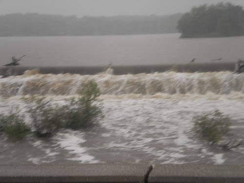 Flood waters overflowing a dam