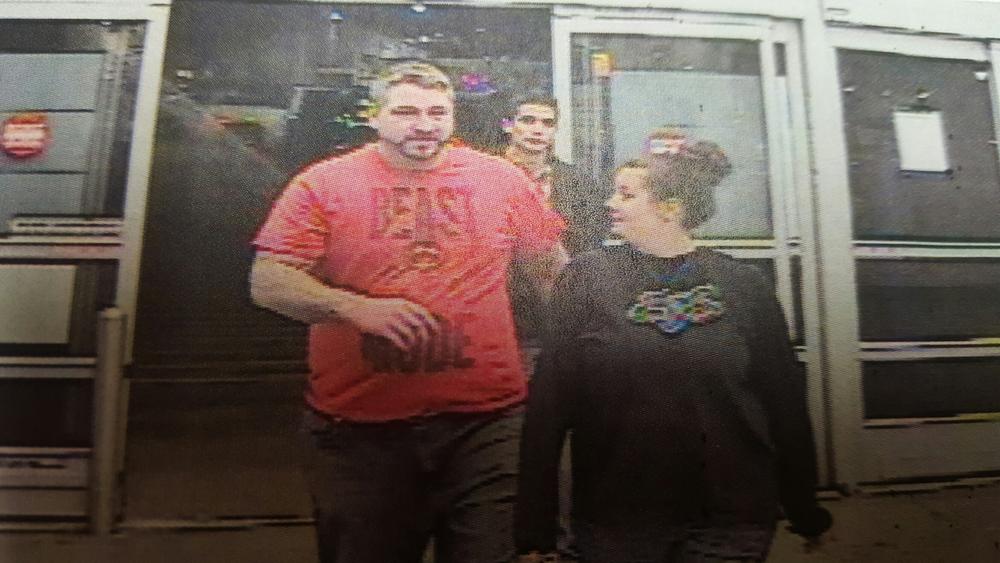 another security camera photo of two individuals - man wearing red Beast Mode shirt and woman in black Fox shirt
