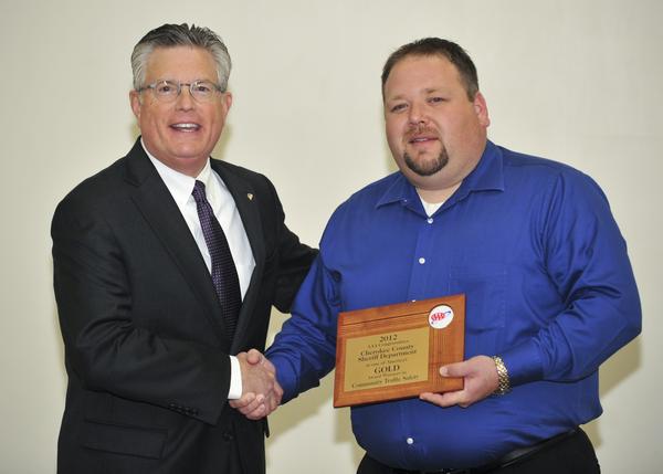 Sheriff Groves shaking hands with AAA Executive Vice President James R. Hanni